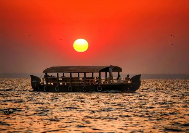 Private Kerala houseboat at sunset